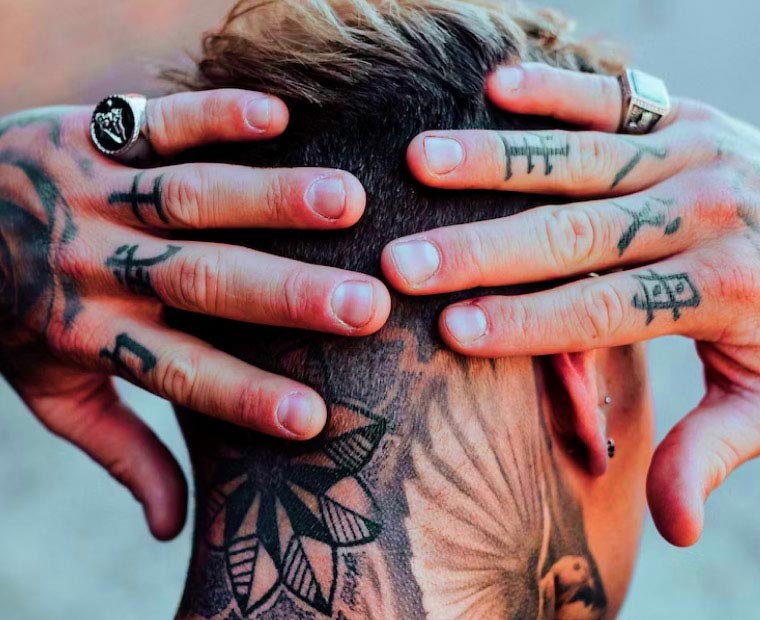Man with Tattoo in the back of the neck and Hands Man with Tattoo in the back of the neck and Hands